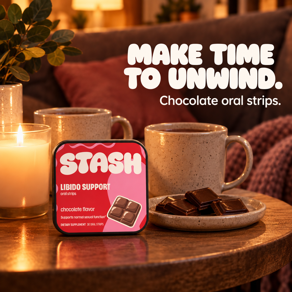 Red and pink Libido Support chocolate tin beside candles, mugs and chocolate