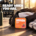 STASH Energy Strips cranberry tin beside a gym bag in morning light