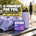 Purple Iron Strips raspberry tin beside running gear on an outdoor bench